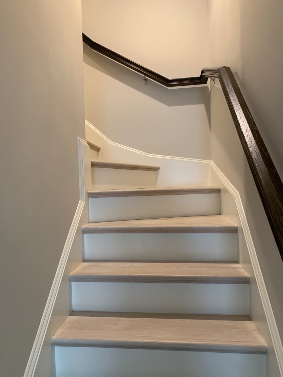 Custom light oak staircase with dark handrail
