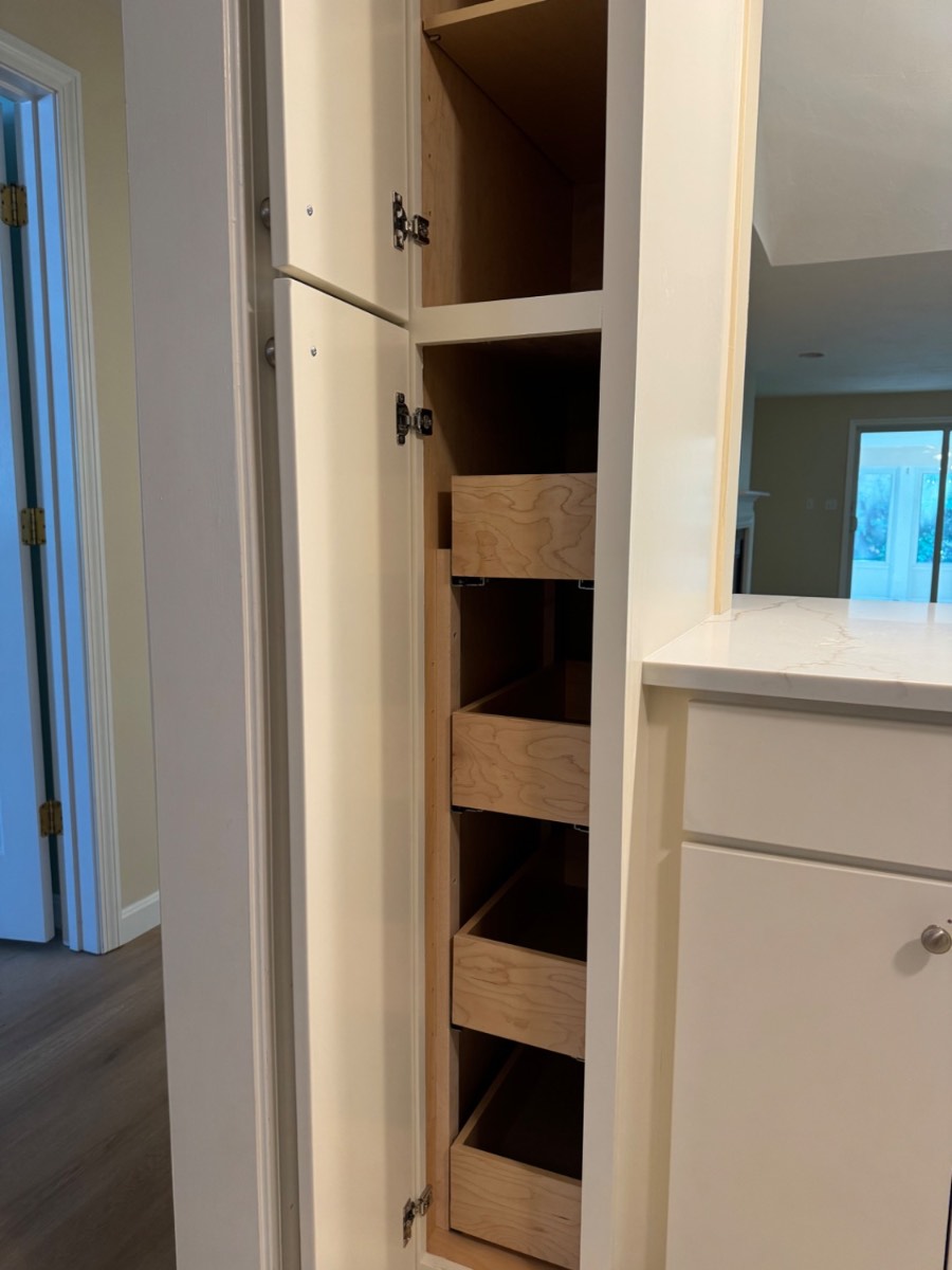 Custom pantry cabinet with soft-close pull-out drawers