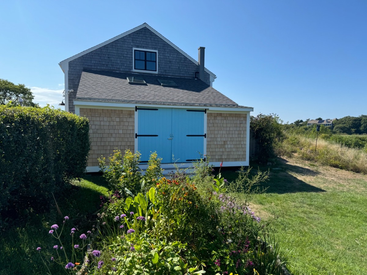Custom shingled barn garage with blue carriage doors, Cape Cod