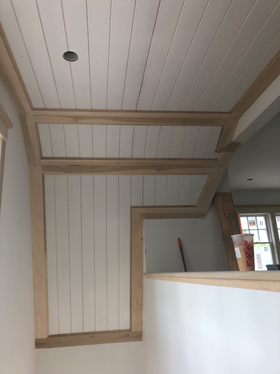 Custom white window bench with storage drawers